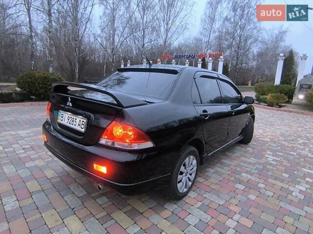 Чорний Міцубісі Lancer, об'ємом двигуна 1.58 л та пробігом 263 тис. км за 4500 $, фото 5 на Automoto.ua