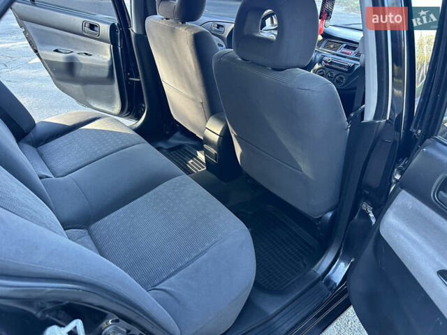 Мицубиси Лансер 2005 в Виннице на Automoto.ua Черный Мицубиси Лансер, объемом двигателя 1.6 л и пробегом 261 тыс. км за 4100 $, фото 45 на Automoto.ua