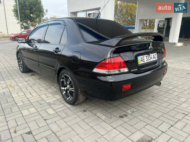 Чорний Міцубісі Lancer, об'ємом двигуна 1.58 л та пробігом 364 тис. км за 4000 $, фото 9 на Automoto.ua