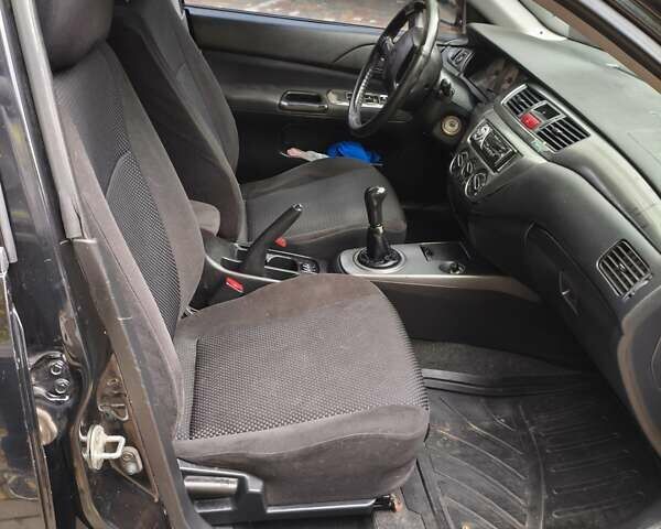 Мицубиси Лансер 2005 в Одессе на Automoto.ua Черный Мицубиси Лансер, объемом двигателя 1.58 л и пробегом 206 тыс. км за 3900 $, фото 13 на Automoto.ua