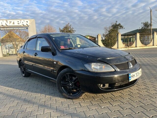 Чорний Міцубісі Lancer, об'ємом двигуна 2 л та пробігом 261 тис. км за 2700 $, фото 13 на Automoto.ua