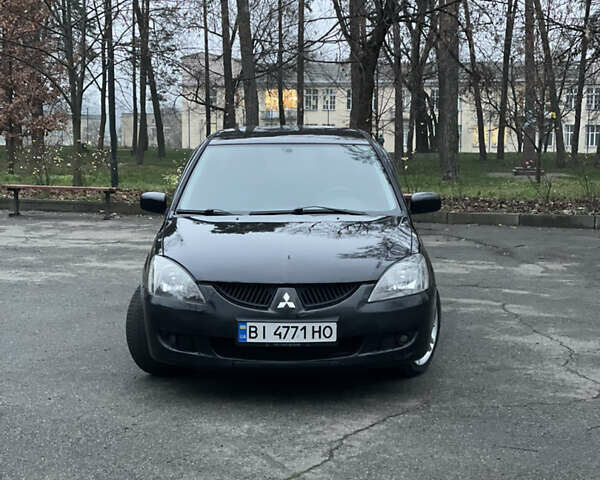 Чорний Міцубісі Lancer, об'ємом двигуна 2 л та пробігом 250 тис. км за 3999 $, фото 2 на Automoto.ua