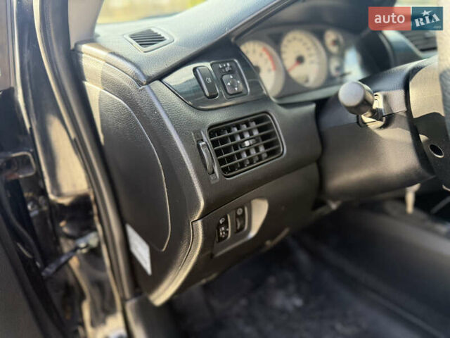 Чорний Міцубісі Lancer, об'ємом двигуна 1.6 л та пробігом 205 тис. км за 3650 $, фото 9 на Automoto.ua