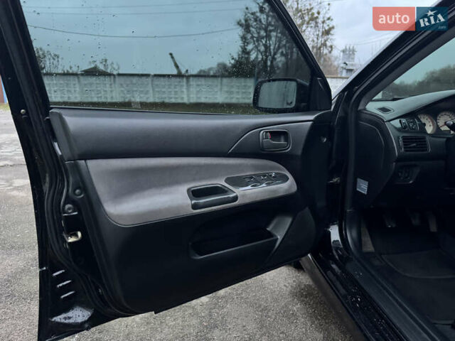 Черный Мицубиси Лансер, объемом двигателя 1.58 л и пробегом 154 тыс. км за 5500 $, фото 25 на Automoto.ua