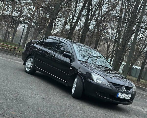 Чорний Міцубісі Lancer, об'ємом двигуна 2 л та пробігом 250 тис. км за 3999 $, фото 1 на Automoto.ua