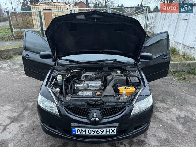 Черный Мицубиси Лансер, объемом двигателя 1.58 л и пробегом 154 тыс. км за 5500 $, фото 20 на Automoto.ua