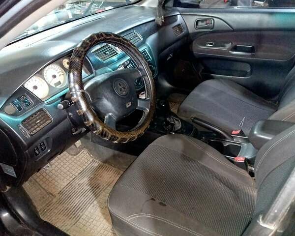 Чорний Міцубісі Lancer, об'ємом двигуна 1.58 л та пробігом 294 тис. км за 3800 $, фото 6 на Automoto.ua