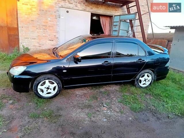 Чорний Міцубісі Lancer, об'ємом двигуна 1.58 л та пробігом 294 тис. км за 3800 $, фото 4 на Automoto.ua