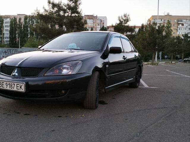 Чорний Міцубісі Lancer, об'ємом двигуна 2 л та пробігом 260 тис. км за 5800 $, фото 1 на Automoto.ua