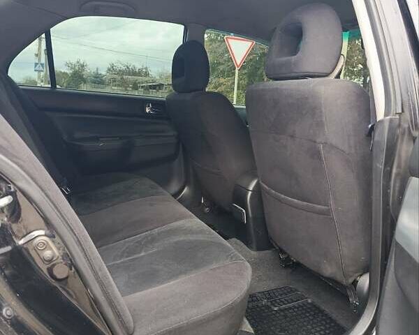 Черный Мицубиси Лансер, объемом двигателя 2 л и пробегом 225 тыс. км за 4400 $, фото 11 на Automoto.ua