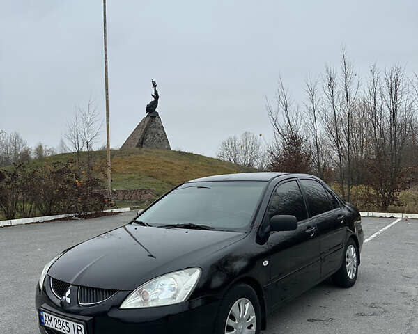 Черный Мицубиси Лансер, объемом двигателя 1.6 л и пробегом 200 тыс. км за 3499 $, фото 5 на Automoto.ua