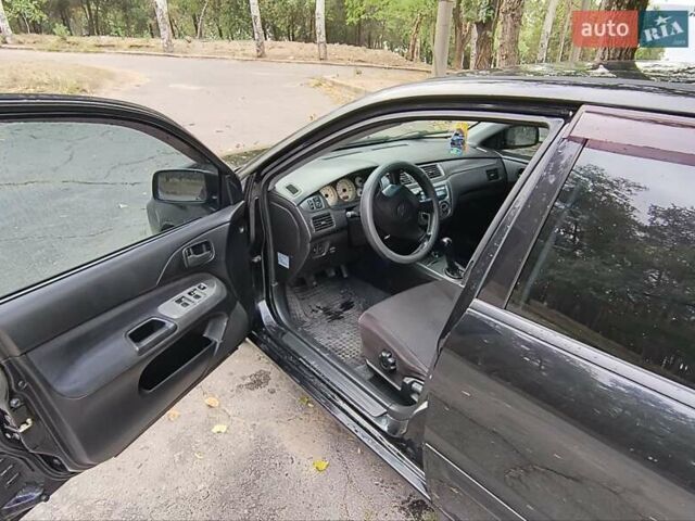 Черный Мицубиси Лансер, объемом двигателя 1.58 л и пробегом 352 тыс. км за 4000 $, фото 2 на Automoto.ua