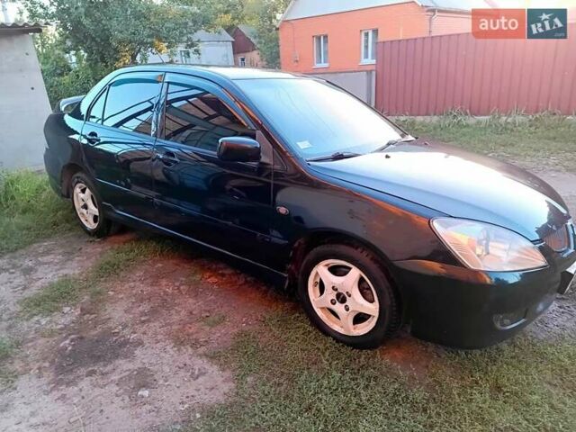 Чорний Міцубісі Lancer, об'ємом двигуна 1.58 л та пробігом 294 тис. км за 3800 $, фото 9 на Automoto.ua