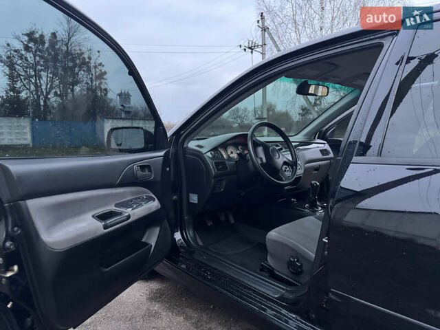 Черный Мицубиси Лансер, объемом двигателя 1.58 л и пробегом 154 тыс. км за 5500 $, фото 24 на Automoto.ua