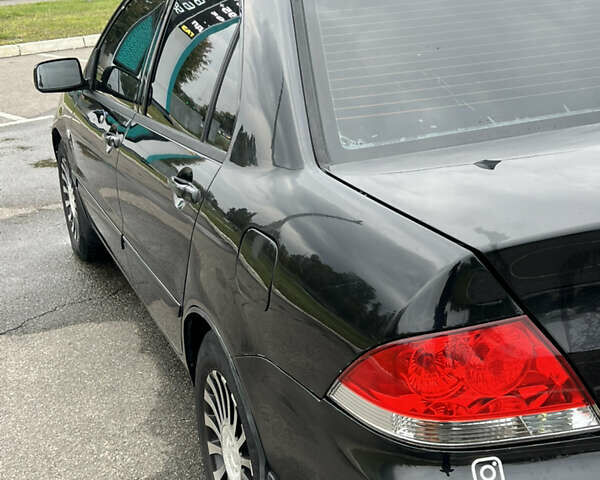 Черный Мицубиси Лансер, объемом двигателя 1.58 л и пробегом 300 тыс. км за 3850 $, фото 9 на Automoto.ua