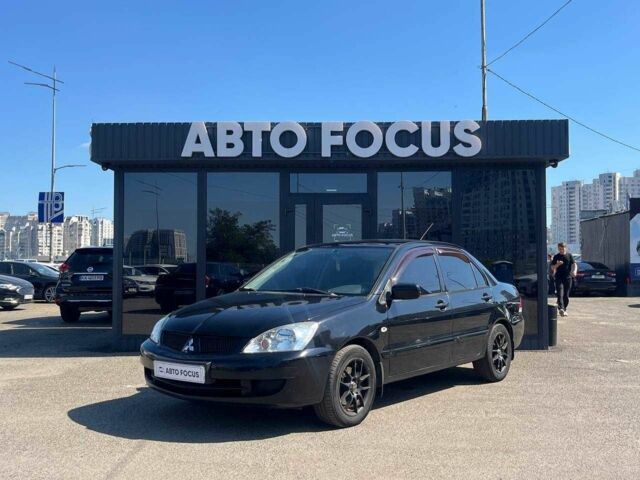 Чорний Міцубісі Lancer, об'ємом двигуна 2 л та пробігом 310 тис. км за 4990 $, фото 3 на Automoto.ua