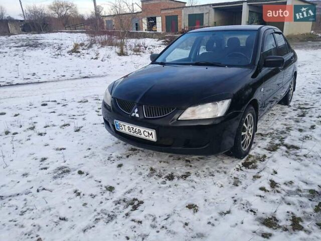 Чорний Міцубісі Lancer, об'ємом двигуна 1.6 л та пробігом 275 тис. км за 2999 $, фото 13 на Automoto.ua