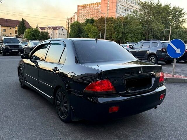 Чорний Міцубісі Lancer, об'ємом двигуна 1.6 л та пробігом 195 тис. км за 3999 $, фото 4 на Automoto.ua