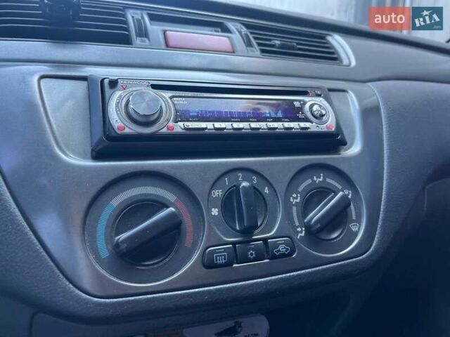 Черный Мицубиси Лансер, объемом двигателя 1.58 л и пробегом 310 тыс. км за 5690 $, фото 23 на Automoto.ua