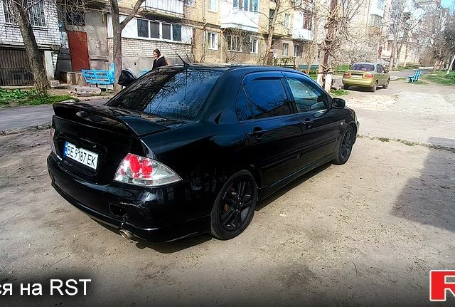 Чорний Міцубісі Lancer, об'ємом двигуна 2 л та пробігом 265 тис. км за 4000 $, фото 6 на Automoto.ua