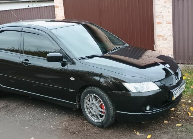 Чорний Міцубісі Lancer, об'ємом двигуна 1.6 л та пробігом 261 тис. км за 4400 $, фото 1 на Automoto.ua