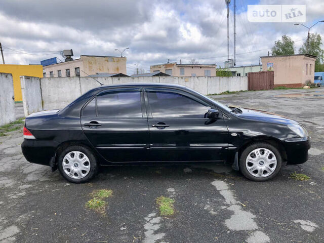 Чорний Міцубісі Lancer, об'ємом двигуна 1.58 л та пробігом 300 тис. км за 3799 $, фото 6 на Automoto.ua