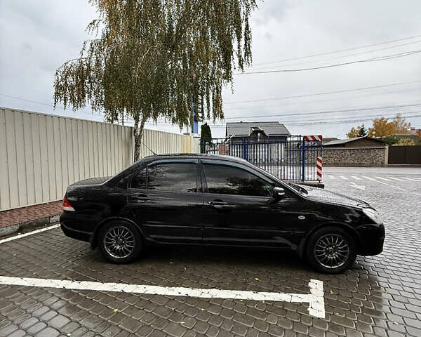 Черный Мицубиси Лансер, объемом двигателя 1.58 л и пробегом 236 тыс. км за 4300 $, фото 10 на Automoto.ua