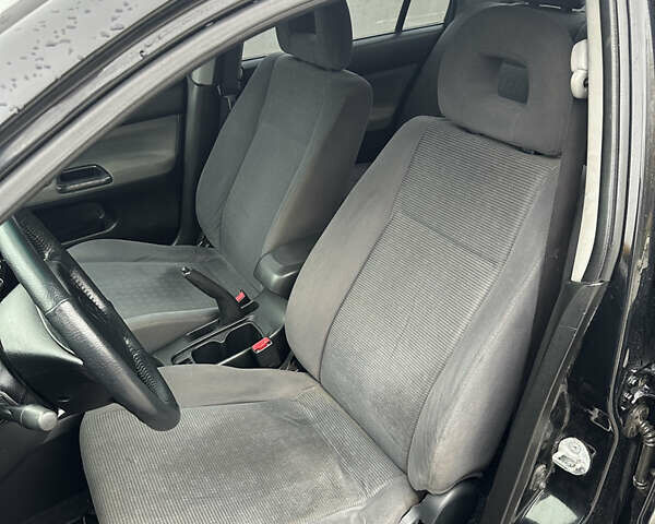 Черный Мицубиси Лансер, объемом двигателя 1.6 л и пробегом 200 тыс. км за 3499 $, фото 9 на Automoto.ua