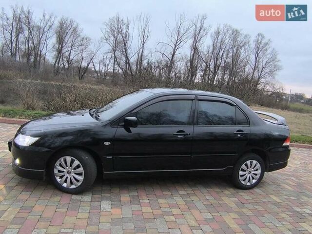 Чорний Міцубісі Lancer, об'ємом двигуна 1.58 л та пробігом 263 тис. км за 4500 $, фото 19 на Automoto.ua