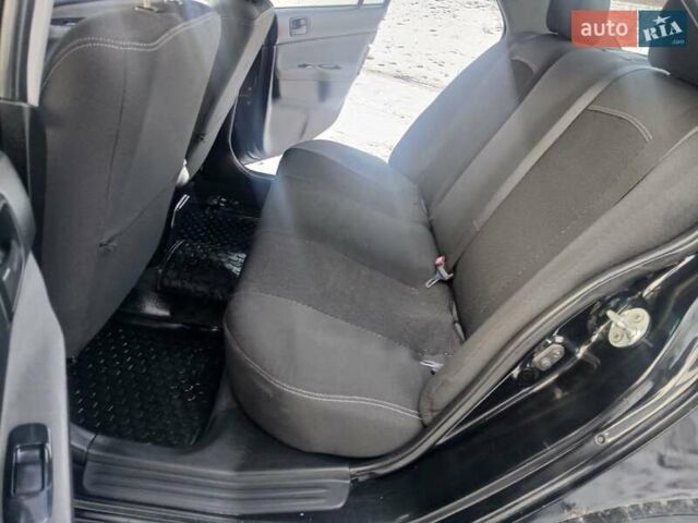 Чорний Міцубісі Lancer, об'ємом двигуна 1.6 л та пробігом 275 тис. км за 2999 $, фото 17 на Automoto.ua