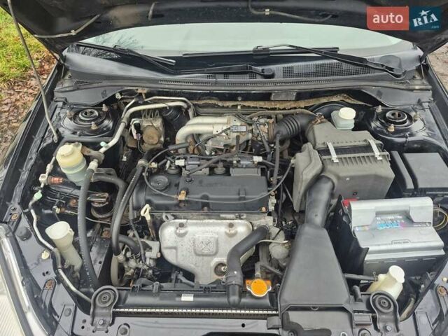 Черный Мицубиси Лансер, объемом двигателя 1.58 л и пробегом 280 тыс. км за 3200 $, фото 14 на Automoto.ua