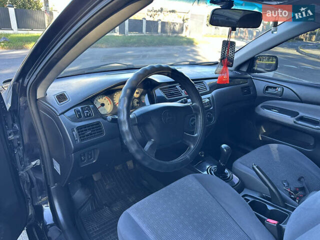 Мицубиси Лансер 2005 в Виннице на Automoto.ua Черный Мицубиси Лансер, объемом двигателя 1.6 л и пробегом 261 тыс. км за 4100 $, фото 36 на Automoto.ua