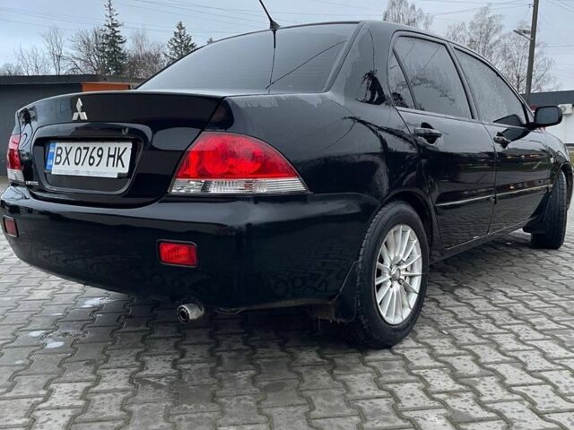 Черный Мицубиси Лансер, объемом двигателя 1.6 л и пробегом 240 тыс. км за 3499 $, фото 1 на Automoto.ua