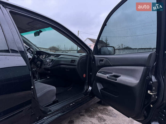 Черный Мицубиси Лансер, объемом двигателя 1.58 л и пробегом 154 тыс. км за 5500 $, фото 34 на Automoto.ua