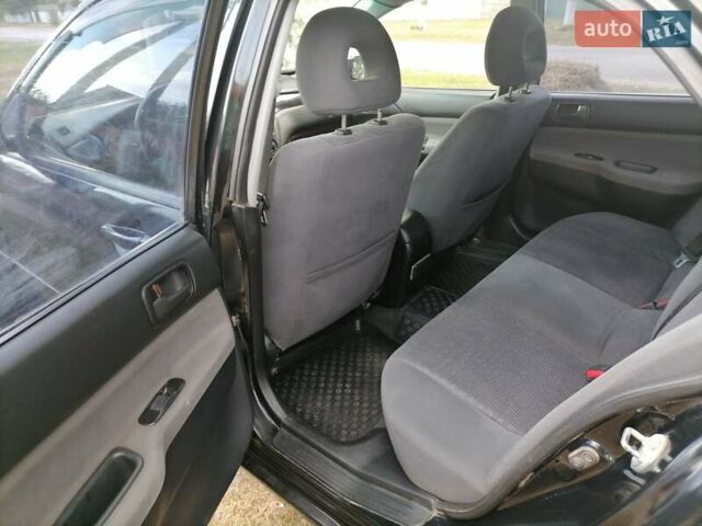 Чорний Міцубісі Lancer, об'ємом двигуна 1.58 л та пробігом 210 тис. км за 2999 $, фото 4 на Automoto.ua