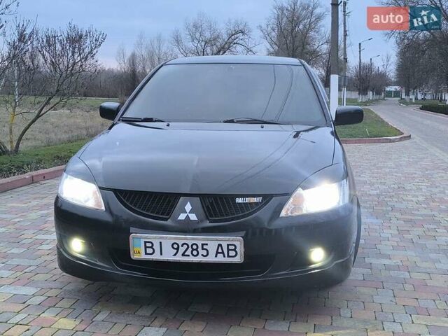 Чорний Міцубісі Lancer, об'ємом двигуна 1.58 л та пробігом 263 тис. км за 4500 $, фото 21 на Automoto.ua