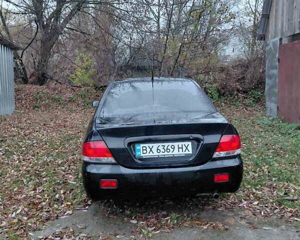 Черный Мицубиси Лансер, объемом двигателя 1.58 л и пробегом 238 тыс. км за 3500 $, фото 8 на Automoto.ua