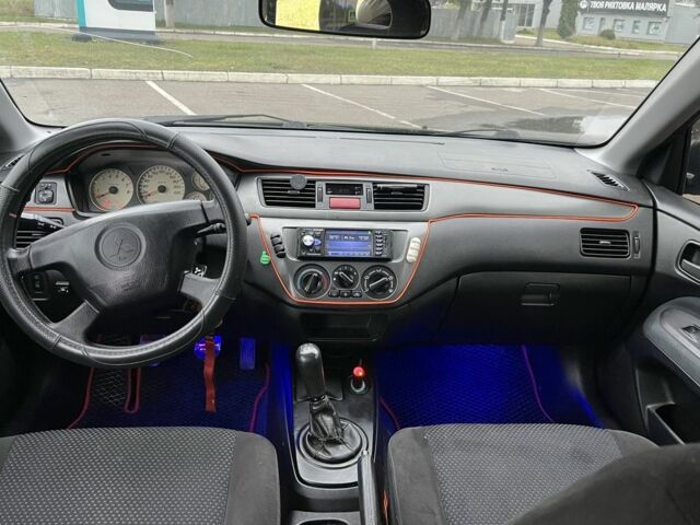 Черный Мицубиси Лансер, объемом двигателя 1.6 л и пробегом 390 тыс. км за 4000 $, фото 7 на Automoto.ua