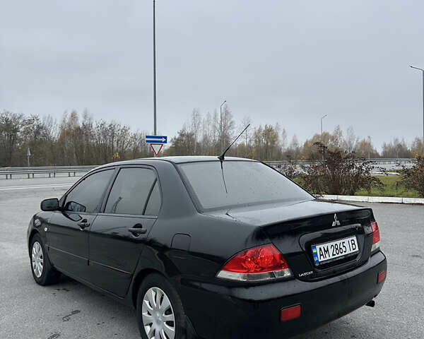 Черный Мицубиси Лансер, объемом двигателя 1.6 л и пробегом 200 тыс. км за 3499 $, фото 3 на Automoto.ua