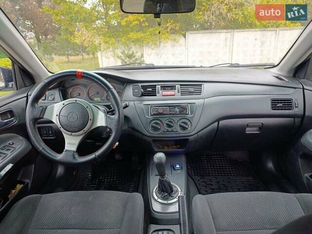 Черный Мицубиси Лансер, объемом двигателя 2 л и пробегом 225 тыс. км за 4400 $, фото 14 на Automoto.ua