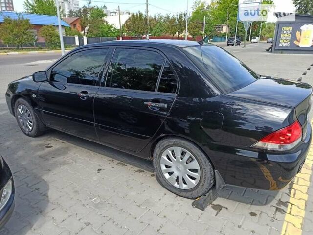 Чорний Міцубісі Lancer, об'ємом двигуна 1.58 л та пробігом 160 тис. км за 3500 $, фото 1 на Automoto.ua