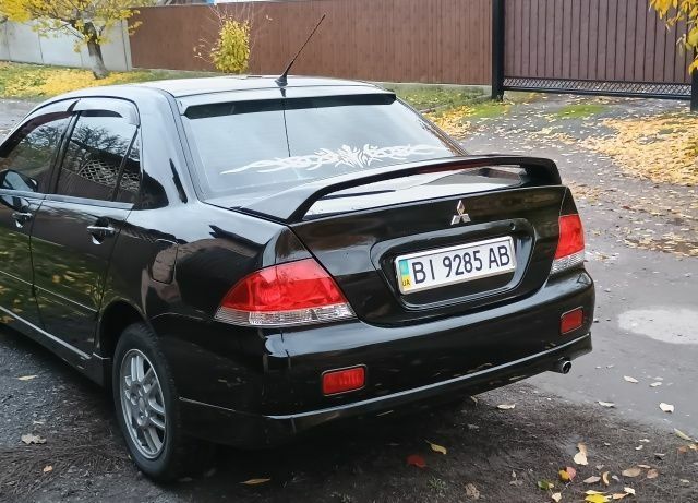 Чорний Міцубісі Lancer, об'ємом двигуна 1.6 л та пробігом 261 тис. км за 4400 $, фото 5 на Automoto.ua