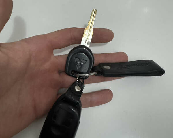 Черный Мицубиси Лансер, объемом двигателя 1.58 л и пробегом 154 тыс. км за 5500 $, фото 44 на Automoto.ua