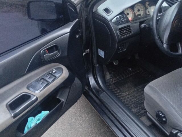 Чорний Міцубісі Lancer, об'ємом двигуна 1.6 л та пробігом 211 тис. км за 3700 $, фото 3 на Automoto.ua