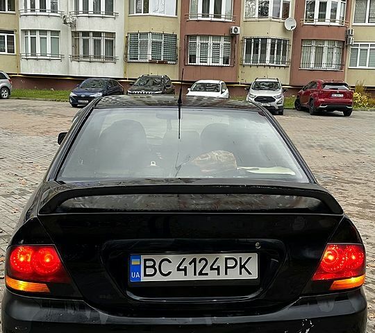 Черный Мицубиси Лансер, объемом двигателя 1.6 л и пробегом 200 тыс. км за 3000 $, фото 4 на Automoto.ua