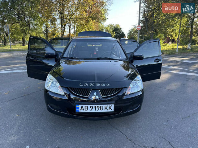 Мицубиси Лансер 2005 в Виннице на Automoto.ua Черный Мицубиси Лансер, объемом двигателя 1.6 л и пробегом 261 тыс. км за 4100 $, фото 58 на Automoto.ua