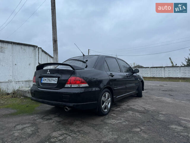 Черный Мицубиси Лансер, объемом двигателя 1.58 л и пробегом 154 тыс. км за 5500 $, фото 8 на Automoto.ua