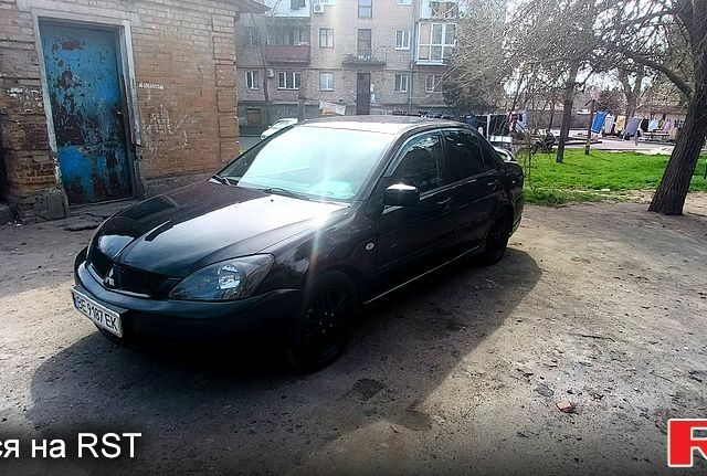 Чорний Міцубісі Lancer, об'ємом двигуна 2 л та пробігом 265 тис. км за 4000 $, фото 2 на Automoto.ua