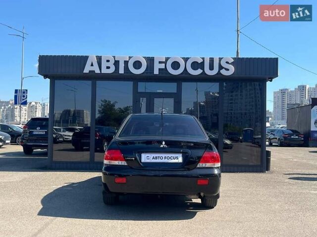 Черный Мицубиси Лансер, объемом двигателя 1.58 л и пробегом 310 тыс. км за 5690 $, фото 6 на Automoto.ua