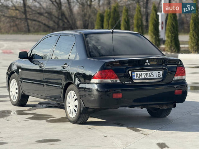 Чорний Міцубісі Lancer, об'ємом двигуна 1.6 л та пробігом 205 тис. км за 3650 $, фото 1 на Automoto.ua